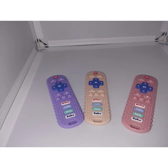 Baby Teethers Roku Remotes Set Of Three Peach Purple And Pink - Picture 1 of 2